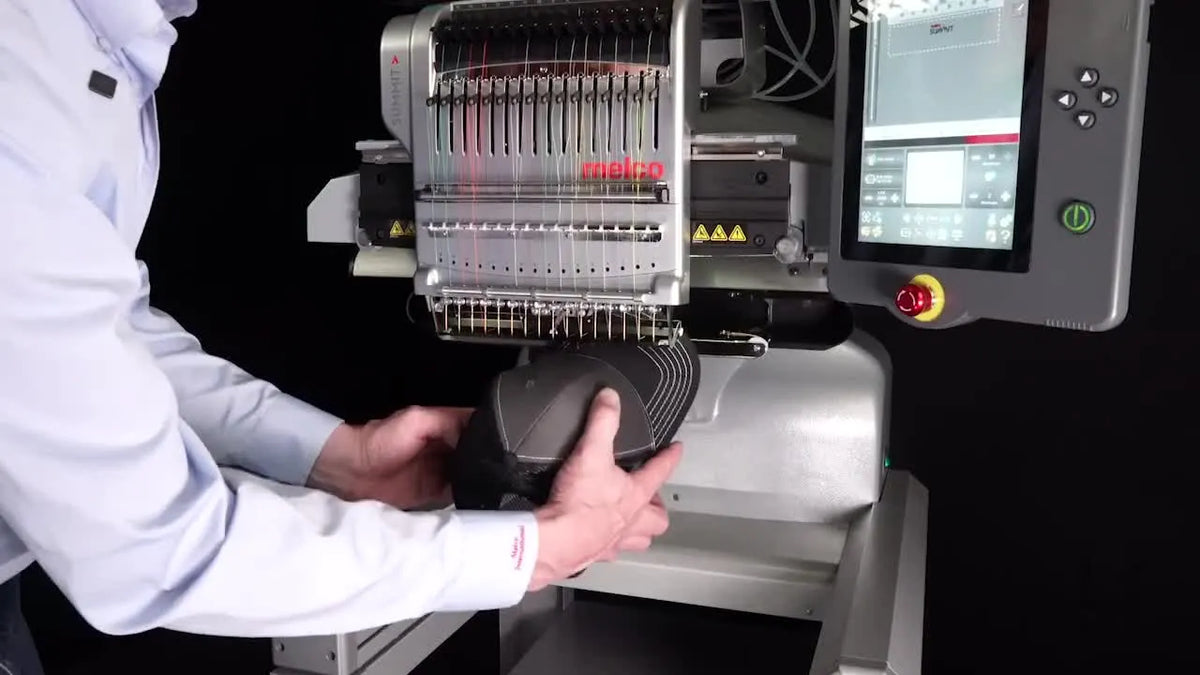 Loading hooped cap onto cap driver of Melco SUMMIT