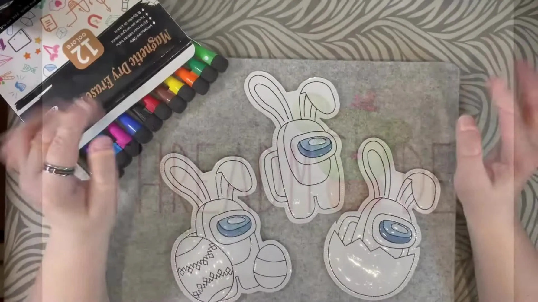 A finished ITH dry-erase coloring doll is shown with markers, ready for gifting or craft-show display.