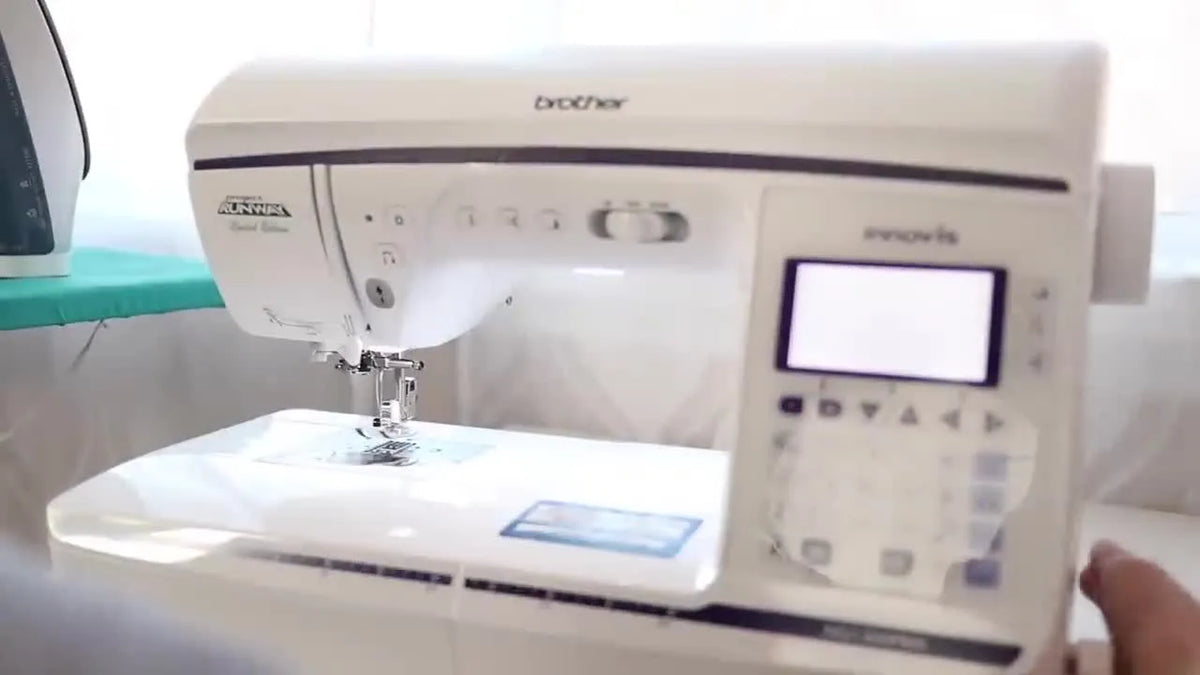A white Brother Innov-is sewing machine on a table.