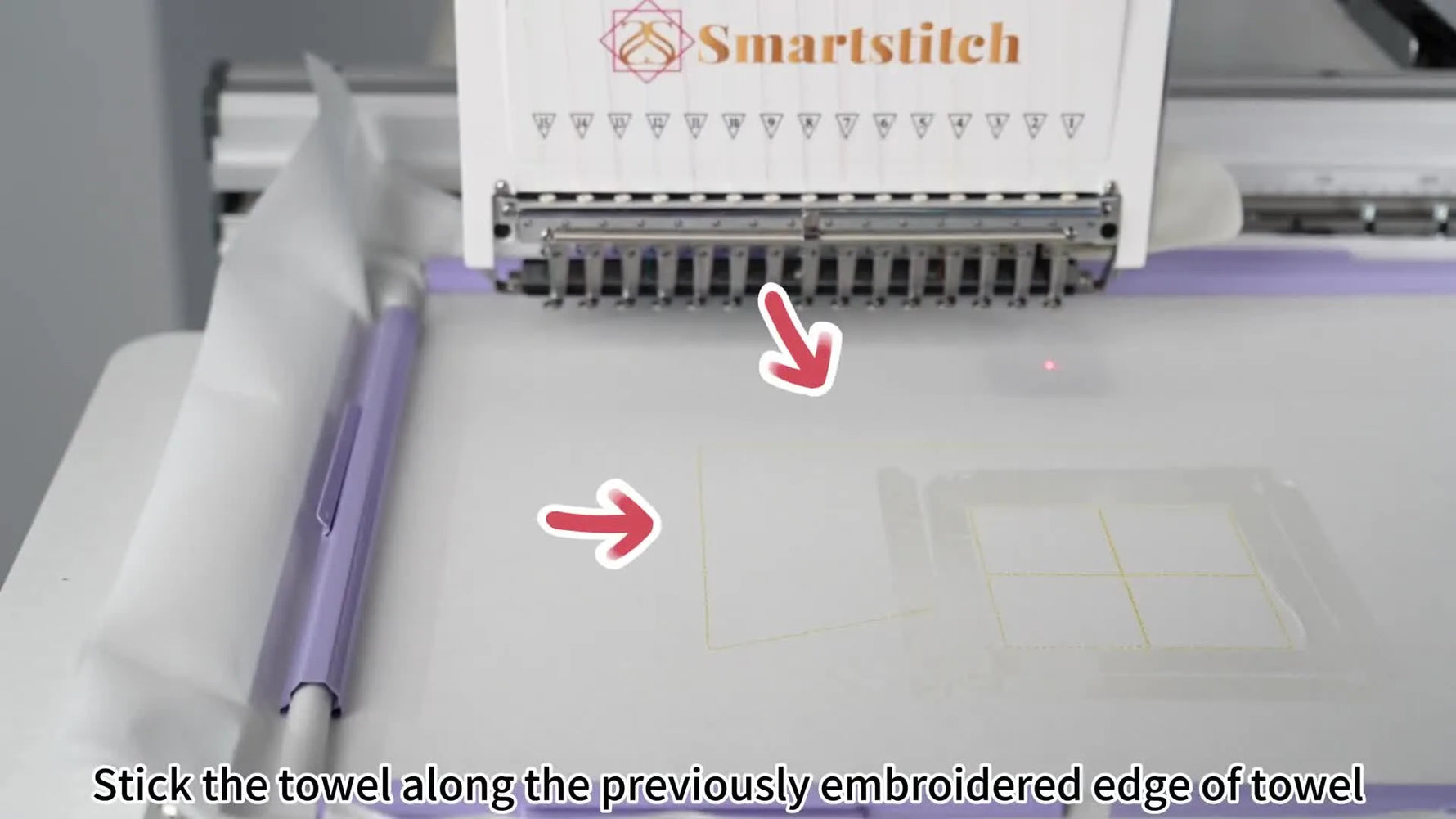 Hands align a blue terry towel precisely against a stitched L-shaped placement guide on stabilizer before embroidery begins.