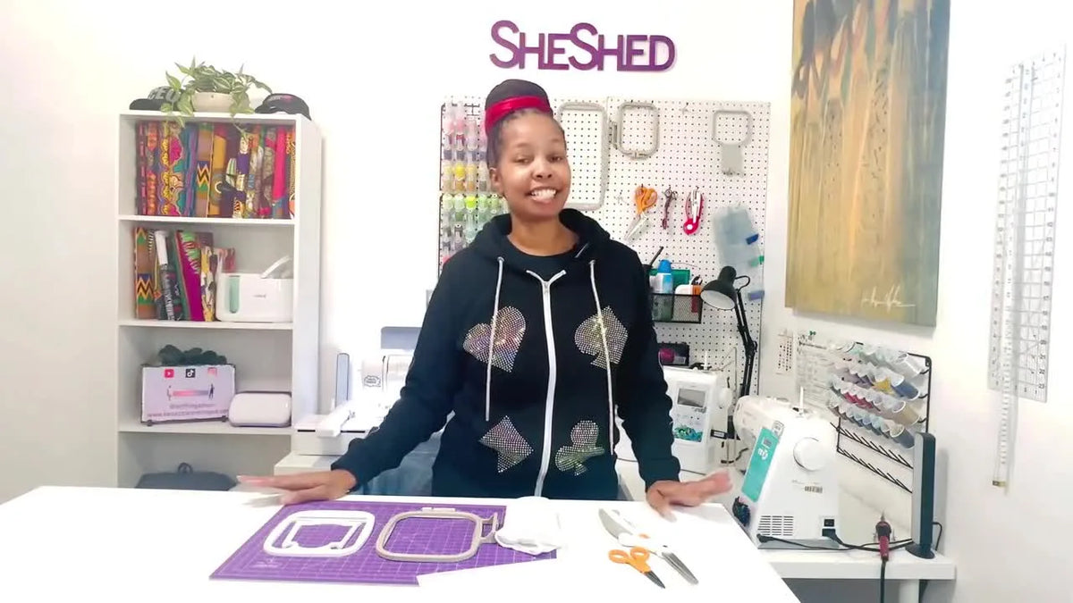 Woman holding a white sock insert, explaining how it's used for embroidery.