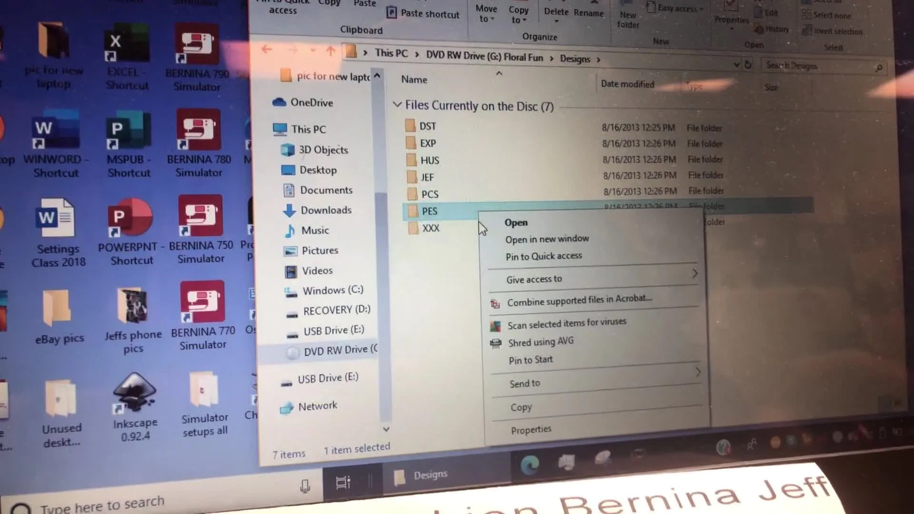 A Windows right‑click menu shows the “Send to” command targeting a USB drive, capturing the fastest way to copy embroidery designs from CD to stick.