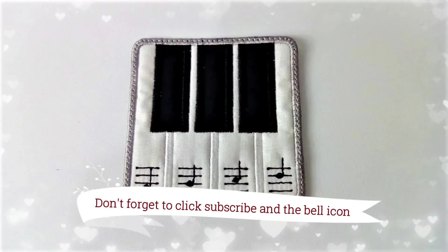 A finished piano-themed ITH coaster with crisp black keys, clean satin borders, and a smooth, fully covered back.