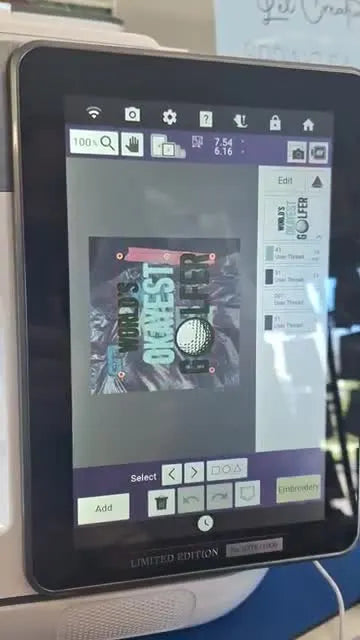 The Brother Avenir screen shows a misaligned digital design over a scanned photo of the hooped towel, ready to be rotated and nudged back into place.
