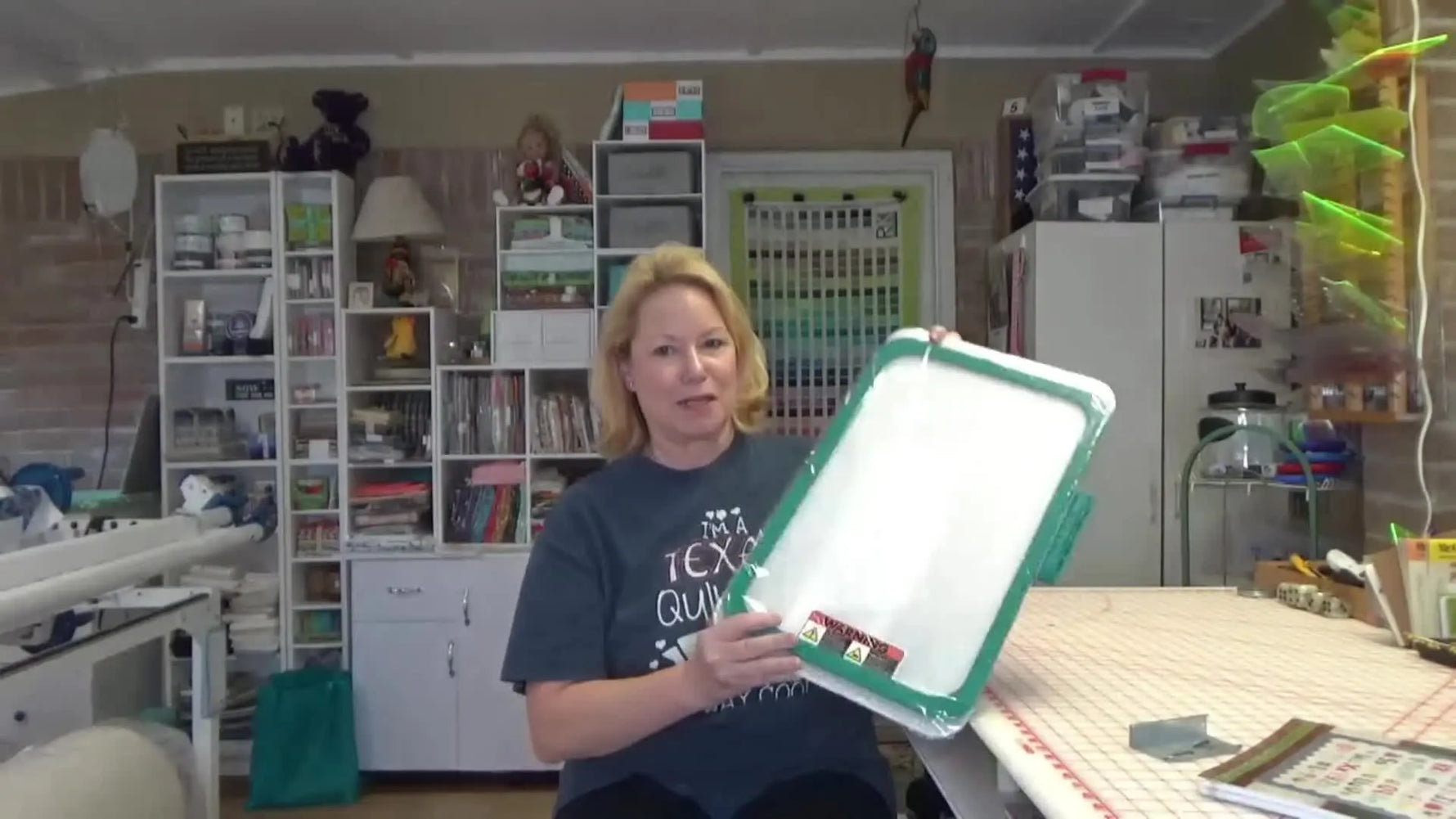 A maker holds up a large rectangular Monster Snap magnetic embroidery hoop, showing the frame and how it’s built for fast, repeatable hooping.