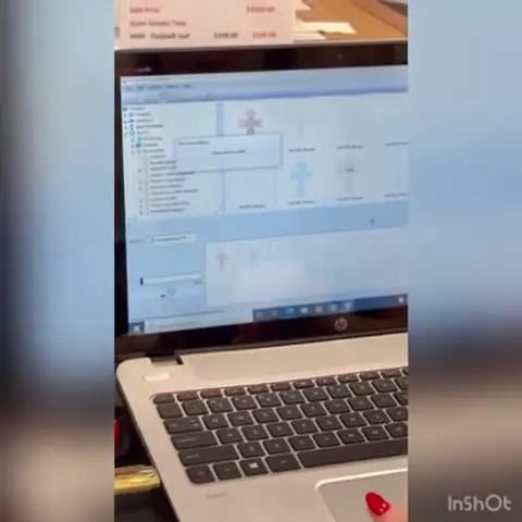 A screen capture shows the blue progress bar as embroidery design data is being sent wirelessly from the computer to the Baby Lock machine.
