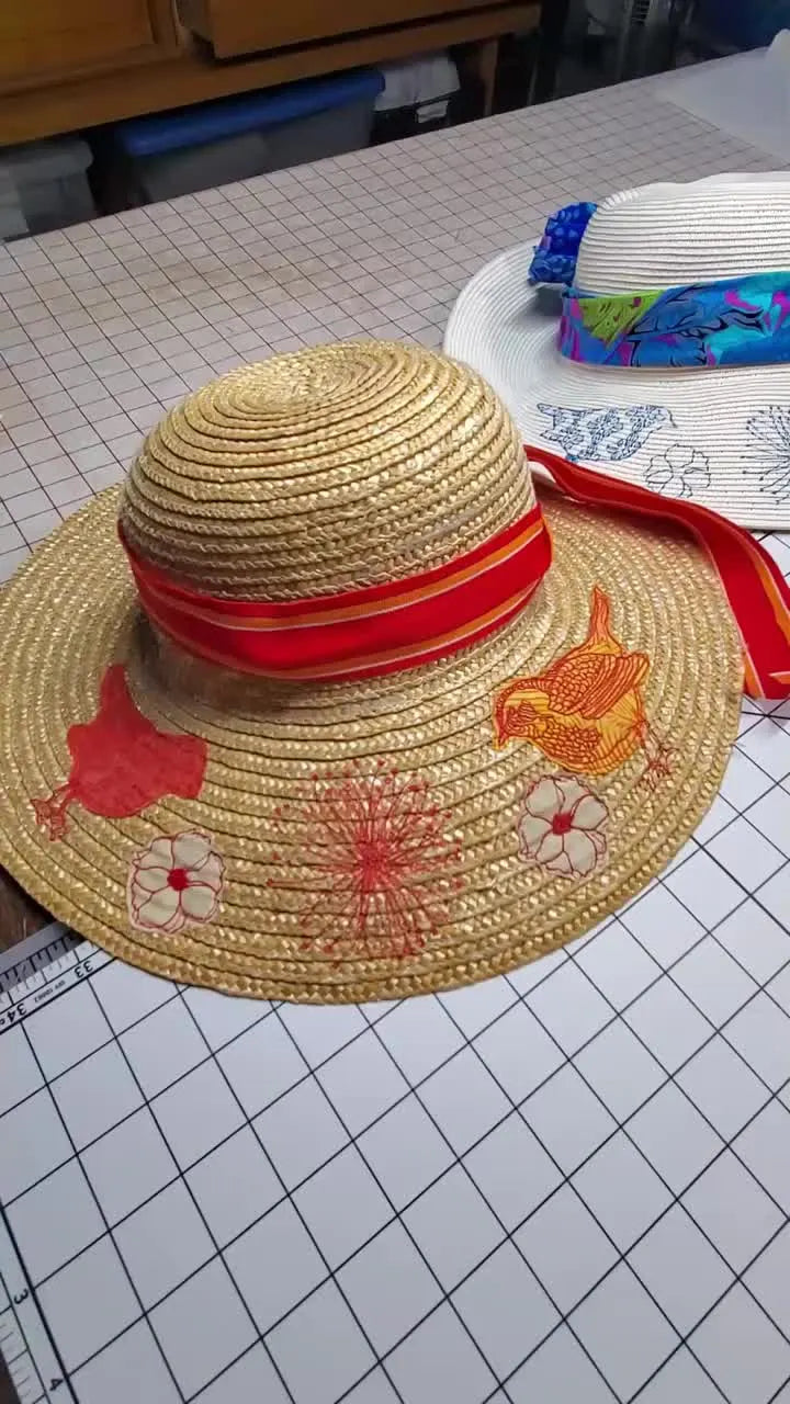 Two embroidered sun hats with ribbons