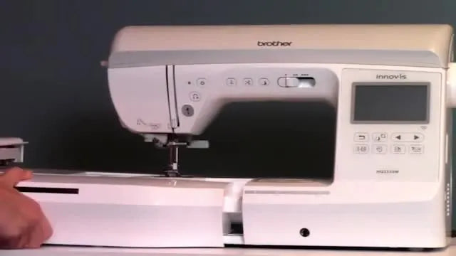 The embroidery unit is being slid into the Brother Innov-is NQ3550W body, aligned to lock in with a clear click before calibration.