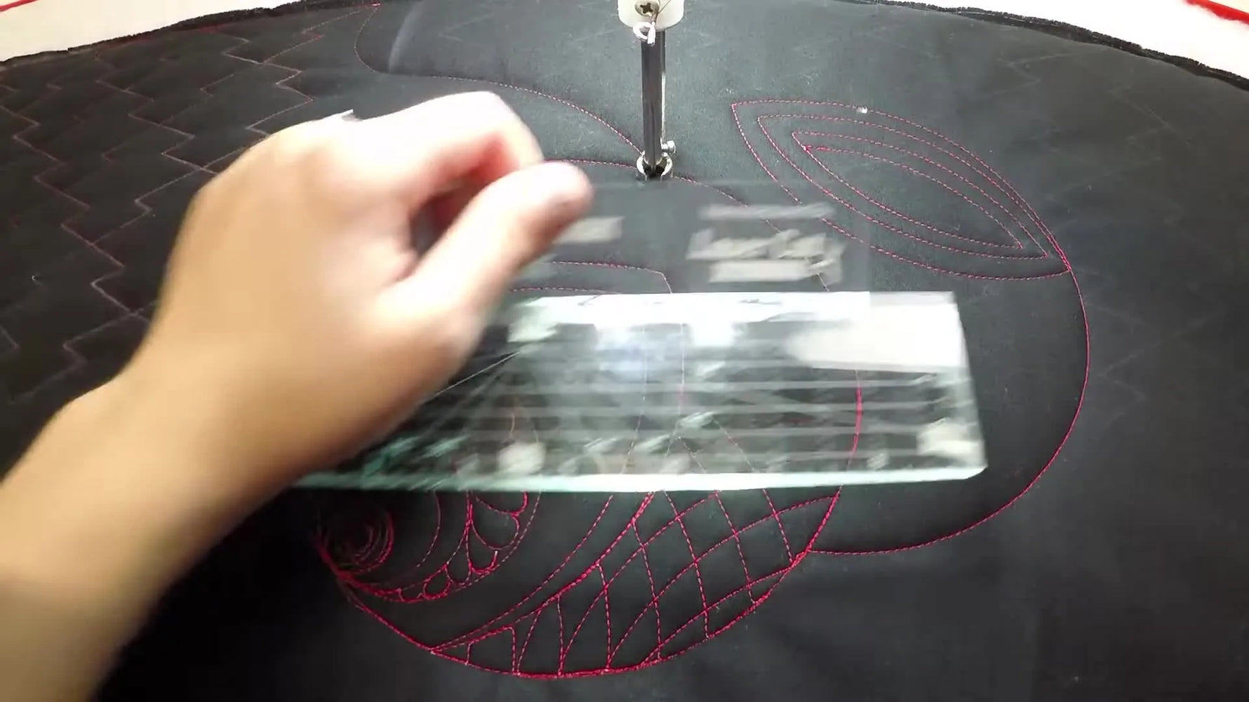 Close-up of the Stunning Straight Edge ruler held over quilted fabric.